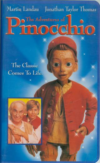 Title 'The Adventures of Pinocchio' in red with embossed border, puppet on right vertical third line with hand in his jacket pocket